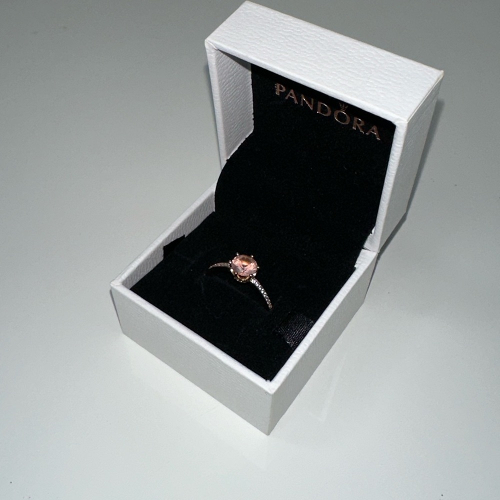 Pink sparkling crown solitaire ring